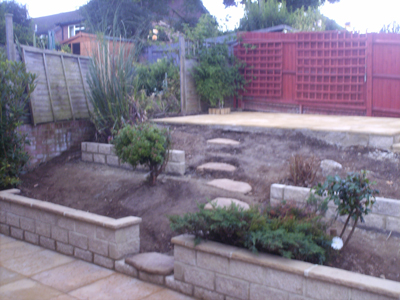 Tiered Garden, granite walls with coping Riven Slab patio and steps 002.jpg